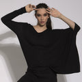 Naomi - blusa em malha assimétrica